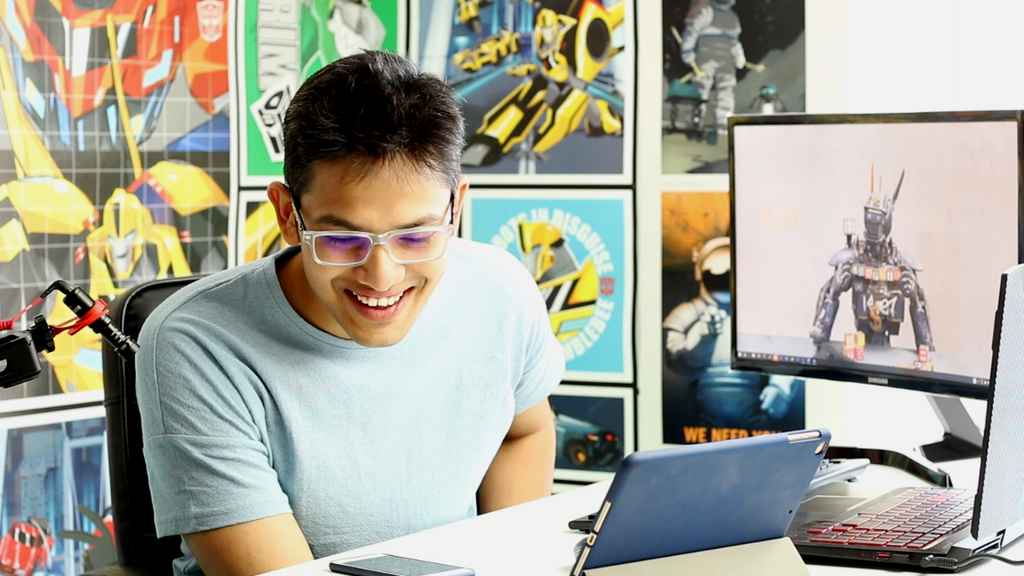 Mayur working at a robotics workstation