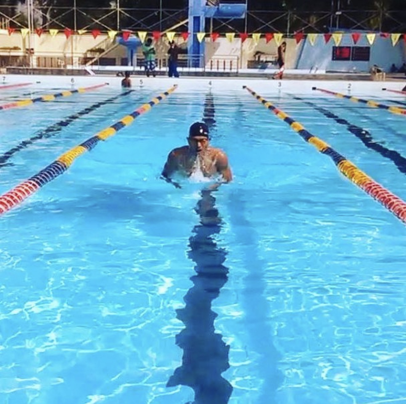 Swimming breaststroke down a competition lane